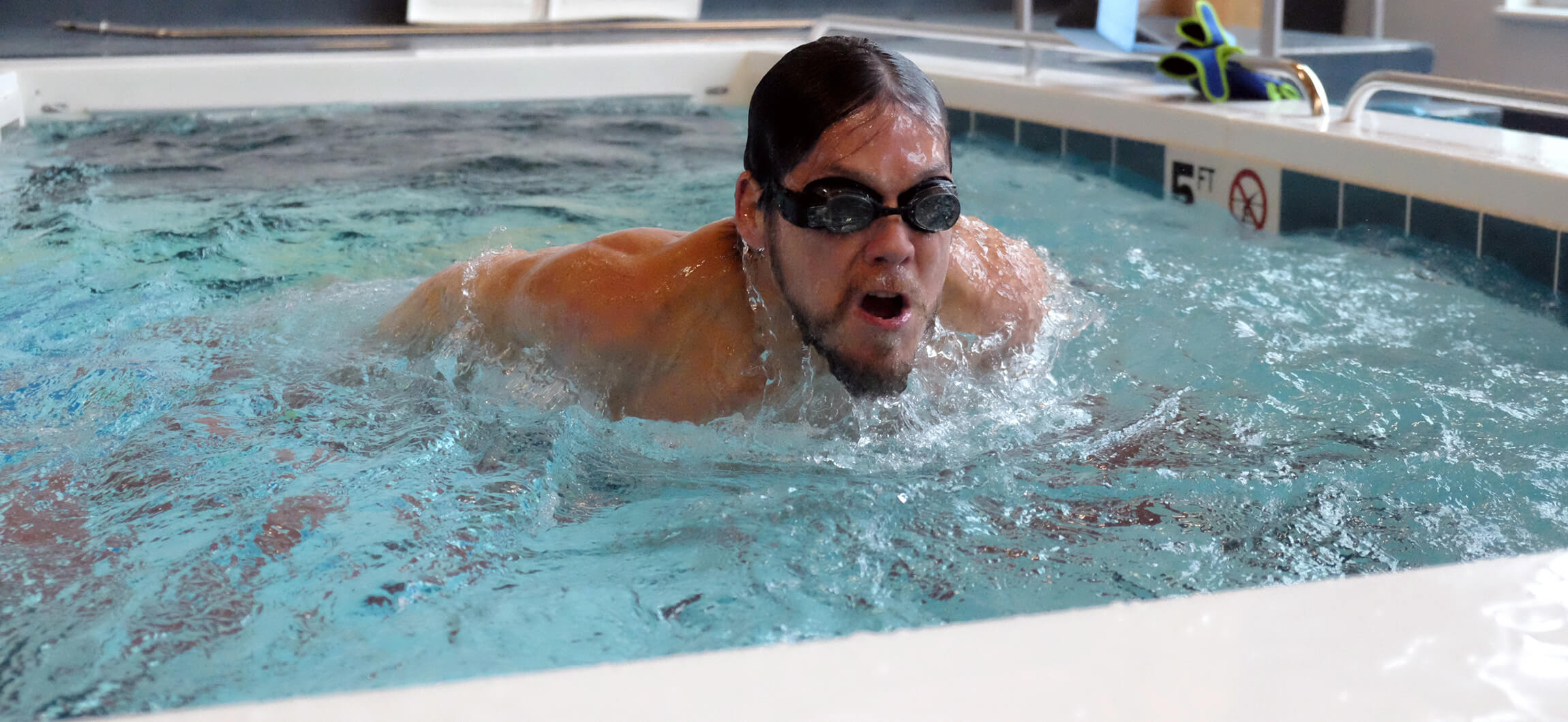 person swimming in pool