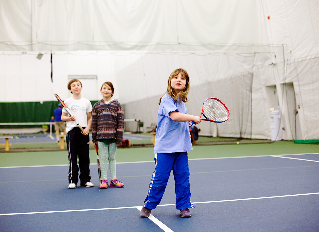 girl playing tennis